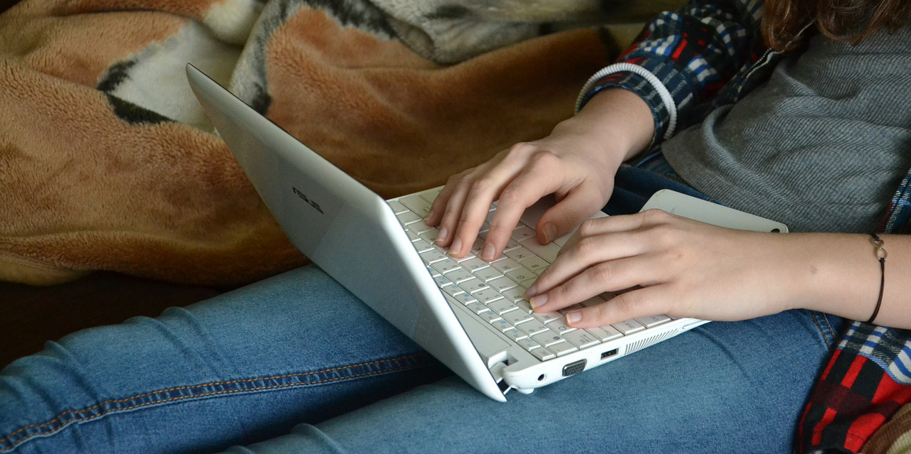 Girl uses laptop computer