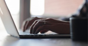 Man typing into computer